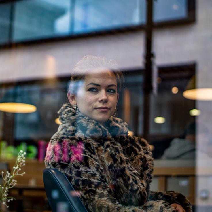 Kaveri Mehta, Lead Design Curator at Sector Bridge Bench, reviewing corporate floral arrangements